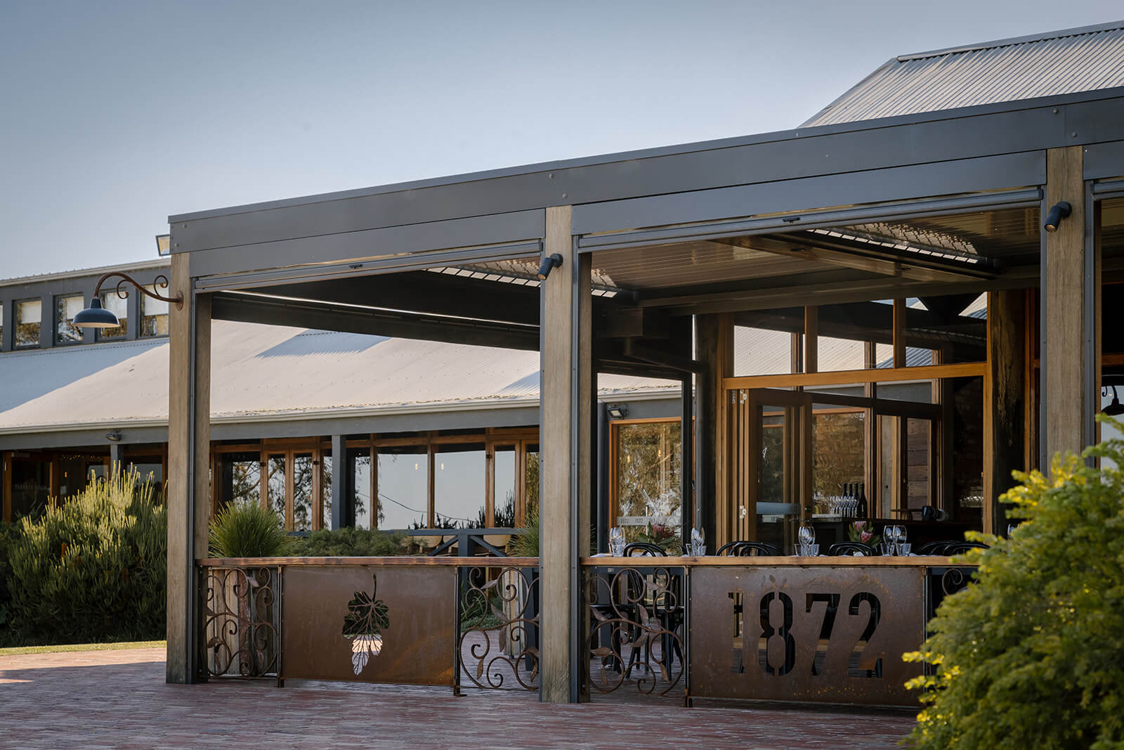Photo of the outside of the restaurant, including undercover dining.